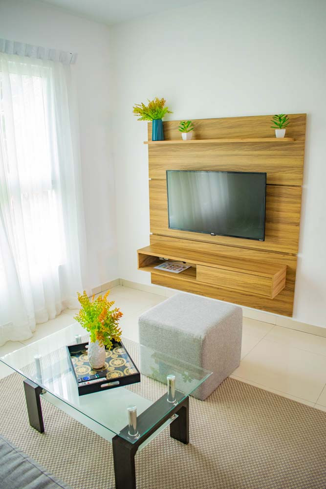 Coffee table, pouffe and TV at Beach Apartamentos in Playa Palmera